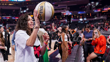 Former WNBA player Sue Bird tosses a ball into the crowd Friday, July 18, 2025, during the WNBA All-Star 3-point contest at Gainbridge Fieldhouse in Indianapolis.