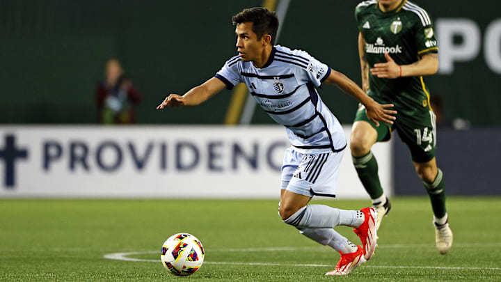 May 25, 2024; Portland, Oregon, USA; Sporting Kansas City midfielder Felipe Hernandez (21) controls the ball against Portland Timbers forward Jonathan Rodriguez (14) during the second half at Providence Park.