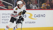 Apr 8, 2025; Pittsburgh, Pennsylvania, USA;  Chicago Blackhawks center Connor Bedard (98) skates with the puck against the Pittsburgh Penguins during the first period at PPG Paints Arena. Mandatory Credit: Charles LeClaire-Imagn Images