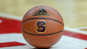 Feb 20, 2019; Raleigh, NC, USA; Basketball with the North Carolina State Wolfpack logo sits on the court during a timeout as the Wolfpack play the Boston College Eagles in the first half at PNC Arena. The North Carolina State Wolfpack won 89-80. Mandatory Credit: Nell Redmond-Imagn Images