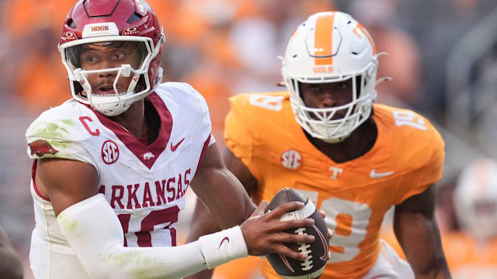 Arkansas quarterback Taylen Green (10) moves out of the pocket as Tennessee defensive lineman Joshua Josephs (19) approaches during an NCAA college football game on Oct. 11, 2025, in Knoxville, Tennessee.