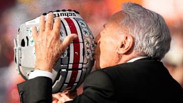 Lee Corso kisses a Buckeye helmet on the set of ESPN College GameDay prior to the NCAA football game between the Ohio State Buckeyes and the Texas Longhorns at Ohio Stadium on Aug. 30, 2025.