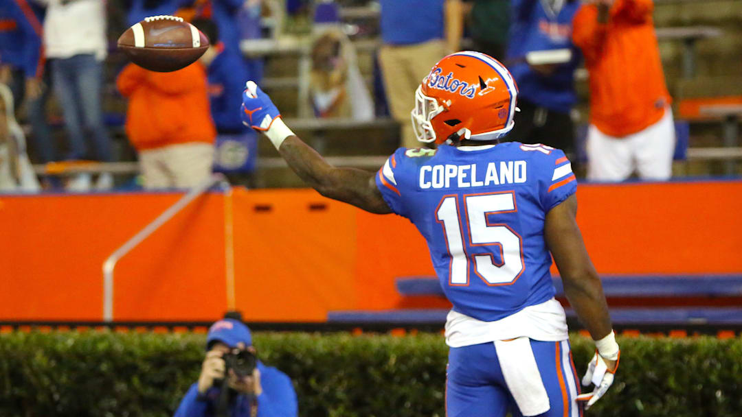 Florida Gators receiver Jacob Copeland (15) flips the ball to a referee after catching a touchdown pass during a game against the LSU Tigers at Ben Hill Griffin Stadium in Gainesville, Fla. Dec. 12, 2020.   [Brad McClenny/The Gainesville Sun]

Flgai 121220 Ufvs Lsu Fb 09