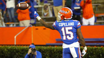 Florida Gators receiver Jacob Copeland (15) flips the ball to a referee after catching a touchdown pass during a game against the LSU Tigers at Ben Hill Griffin Stadium in Gainesville, Fla. Dec. 12, 2020.   [Brad McClenny/The Gainesville Sun]

Flgai 121220 Ufvs Lsu Fb 09