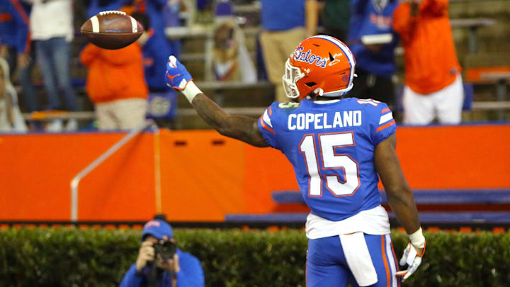 Florida Gators receiver Jacob Copeland (15) flips the ball to a referee after catching a touchdown pass during a game against the LSU Tigers at Ben Hill Griffin Stadium in Gainesville, Fla. Dec. 12, 2020.   [Brad McClenny/The Gainesville Sun]

Flgai 121220 Ufvs Lsu Fb 09