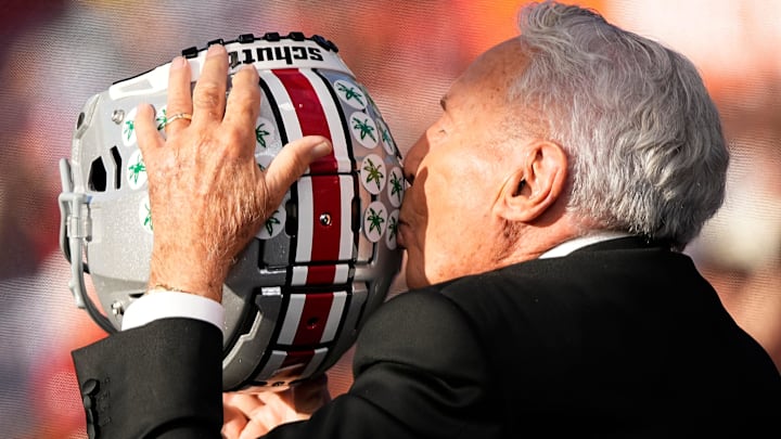 Lee Corso kisses a Buckeye helmet on the set of ESPN College GameDay prior to the NCAA football game between the Ohio State Buckeyes and the Texas Longhorns at Ohio Stadium on Aug. 30, 2025.