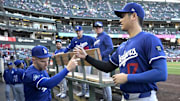 Mar 24, 2025; Anaheim, California, USA;  Los Angeles Dodgers designated hitter Shohei Ohtani (17) is greeted by first baseman Freddie Freeman (5) in the dugout for the game against the Los Angeles Angels at Angel Stadium. 