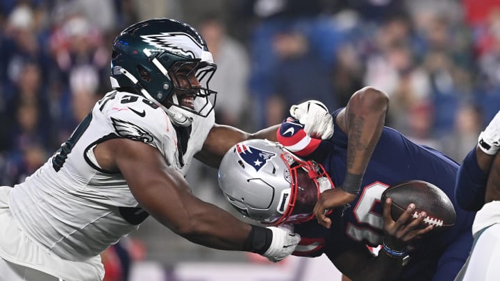 Aug 15, 2024; Foxborough, MA, USA; Philadelphia Eagles defensive tackle Thomas Booker IV (59) sacks New England Patriots quarterback Joe Milton III (19) during the second half at Gillette Stadium. Mandatory Credit: Eric Canha-USA TODAY Sports