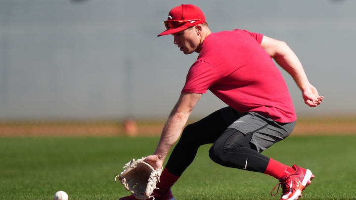 Cincinnati Reds shortstop Matt McLain (9) fields a groundball during spring training workouts, Wednesday, Feb. 14, 2024, at the team   s spring training facility in Goodyear, Ariz.