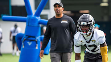 Jacksonville Jaguars defensive backs coach Anthony Perkins barks out orders as Jacksonville Jaguars wide receiver Travis Hunter (12) prepares to run a drill during the Jacksonville Jaguars’ mandatory minicamp Tuesday June 10, 2025 at the Miller Electric Center in Jacksonville, Fla. [Doug Engle/Florida Times-Union]