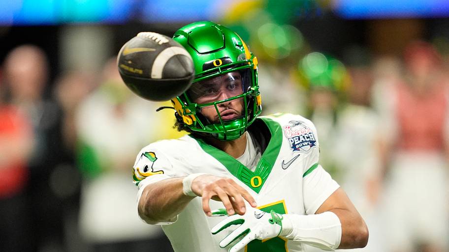 Oregon quarterback Dante Moore throws a pass 
