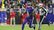 Nov 7, 2024; Baltimore, Maryland, USA; Baltimore Ravens quarterback Lamar Jackson (8) looks to pass on the run during the first quarter  against the Cincinnati Bengals at M&T Bank Stadium. Mandatory Credit: Tommy Gilligan-Imagn Images