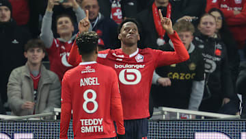 Angel Gomes and Jonathan David celebrate together for Lille
