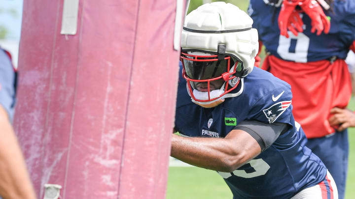 Aug 03, 2024; Foxborough, MA, USA; New England Patriots linebacker Joshua Uche (55) does a drill during training camp at Gillette Stadium. Mandatory Credit: Eric Canha-USA TODAY Sports