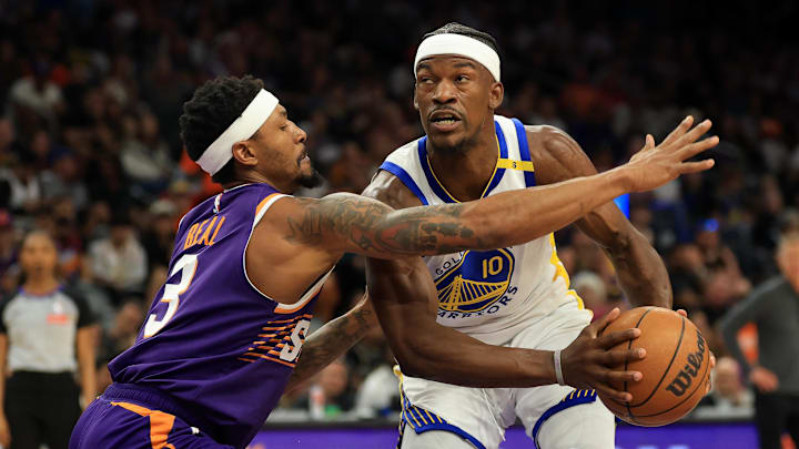 Apr 8, 2025; Phoenix, Arizona, USA; Golden State Warriors forward Jimmy Butler III (10) drives to the basket against Phoenix Suns guard Bradley Beal (3) during the first half at Footprint Center. Mandatory Credit: Mark J. Rebilas-Imagn Images