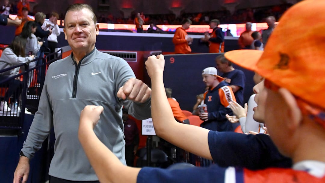 Nov 22, 2025; Champaign, Illinois, USA; Illinois Fighting Illini head coach Brad Underwood greets fans before the opening tip off against the Long Island University Sharks at State Farm Center. Mandatory Credit: Ron Johnson-Imagn Images Nov 22, 2025; Champaign, Illinois, USA; Illinois Fighting Illini head coach Brad Underwood greets fans before the opening tip off against the Long Island University Sharks at State Farm Center. Mandatory Credit: Ron Johnson-Imagn Images
