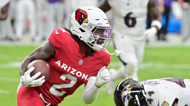 Oct 29, 2023; Glendale, Arizona, USA; Arizona Cardinals wide receiver Marquise Brown (2) runs with the ball as Baltimore Ravens cornerback Marlon Humphrey (44) defends in the first half at State Farm Stadium. Mandatory Credit: Matt Kartozian-USA TODAY Sports