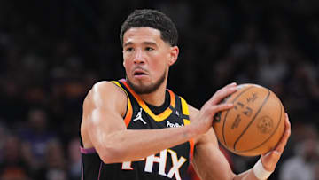 Phoenix Suns guard Devin Booker (1) controls the ball against the New Orleans Pelicans during the second half at Footprint Center on Feb. 28, 2025. Mandatory Credit: Joe Camporeale-Imagn Images