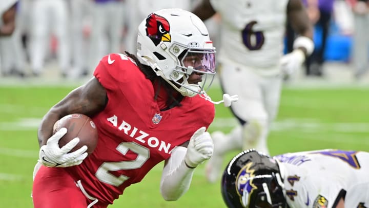 Oct 29, 2023; Glendale, Arizona, USA; Arizona Cardinals wide receiver Marquise Brown (2) runs with the ball as Baltimore Ravens cornerback Marlon Humphrey (44) defends in the first half at State Farm Stadium. Mandatory Credit: Matt Kartozian-USA TODAY Sports