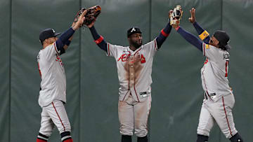 Aug 25, 2023; San Francisco, California, USA; Atlanta Braves center fielder Michael Harris II (center) celebrates with left fielder Eddie Rosario (left) and right fielder Ronald Acuna Jr. (right) after defeating the San Francisco Giants at Oracle Park. Mandatory Credit: Darren Yamashita-Imagn Images