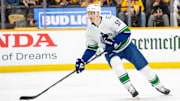 May 3, 2024; Nashville, Tennessee, USA; Vancouver Canucks defenseman Tyler Myers (57) skates with the puck against the Nashville Predators during the first period in game six of the first round of the 2024 Stanley Cup Playoffs at Bridgestone Arena. Mandatory Credit: Steve Roberts-Imagn Images