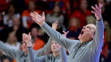 Mar 7, 2025; Champaign, Illinois, USA;  Illinois Fighting Illini head coach Brad Underwood reacts to a call with his assistants during the second half against the Purdue Boilermakers at State Farm Center. Mandatory Credit: Ron Johnson-Imagn Images