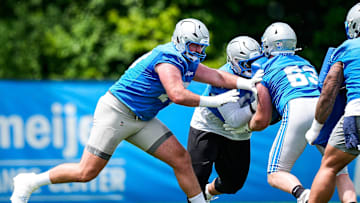 Detroit Lions offensive tackle Dan Skipper (70), center, practices during OTA at Meijer Performance Center in Allen Park on Friday, May 30, 2025.
