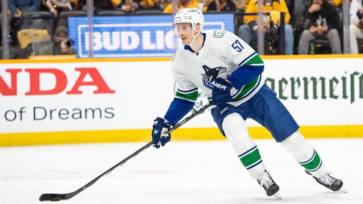 May 3, 2024; Nashville, Tennessee, USA; Vancouver Canucks defenseman Tyler Myers (57) skates with the puck against the Nashville Predators during the first period in game six of the first round of the 2024 Stanley Cup Playoffs at Bridgestone Arena. Mandatory Credit: Steve Roberts-Imagn Images