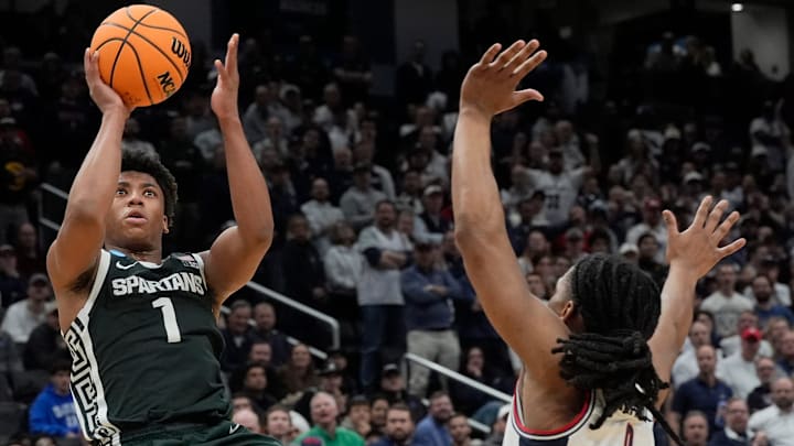 Michigan State guard Jeremy Fears Jr. (1) shoots falling backwards as Connecticut guard Solo Ball (1) defends during the second half of the 2026 NCAA Men's Basketball East Regional game against UConn at Capital One Arena in Washington DC on Friday, March 27, 2026. 
Michigan State lost the game 67-63.