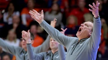 Mar 7, 2025; Champaign, Illinois, USA;  Illinois Fighting Illini head coach Brad Underwood reacts to a call with his assistants during the second half against the Purdue Boilermakers at State Farm Center. Mandatory Credit: Ron Johnson-Imagn Images