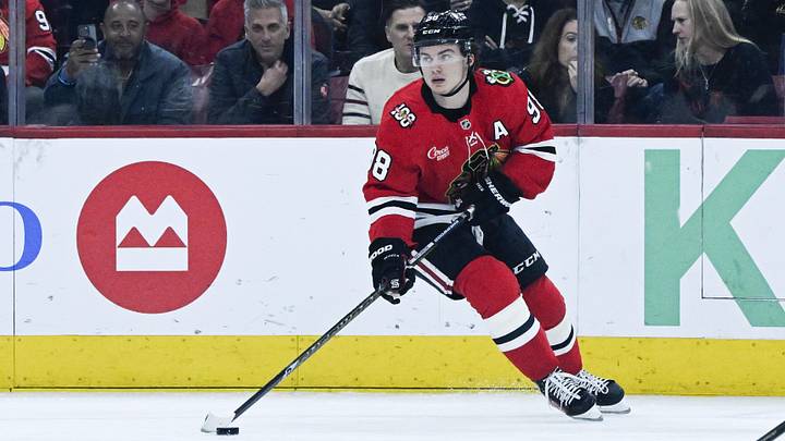 Mar 6, 2026; Chicago, Illinois, USA;  Chicago Blackhawks center Connor Bedard (98) moves the puck against the Vancouver Canucks during the first period at United Center. Mandatory Credit: Matt Marton-Imagn Images