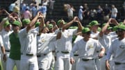 Jun 2, 2023; Nashville, TN, USA;  Oregon Ducks celebrate the win with the fans in the stadium against the Xavier Musketeers during the Nashville Regional at Hawkins Field. Mandatory Credit: Steve Roberts-USA TODAY Sports