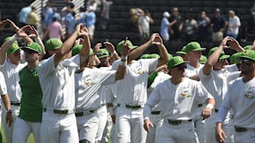 Jun 2, 2023; Nashville, TN, USA;  Oregon Ducks celebrate the win with the fans in the stadium against the Xavier Musketeers during the Nashville Regional at Hawkins Field. Mandatory Credit: Steve Roberts-USA TODAY Sports