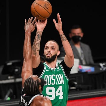 May 22, 2021; Brooklyn, New York, USA; Boston Celtics guard Evan Fournier (94) shoots a three-point shot defended by Brooklyn Nets guard James Harden (13) during the first quarter of game one in the first round of the 2021 NBA Playoffs. at Barclays Center. Mandatory Credit: Dennis Schneidler-USA TODAY Sports