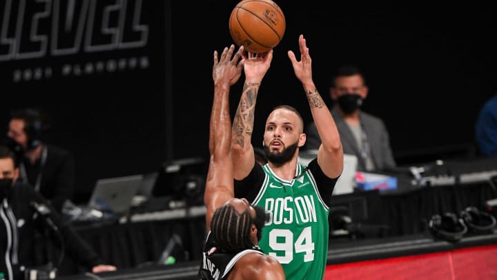 May 22, 2021; Brooklyn, New York, USA; Boston Celtics guard Evan Fournier (94) shoots a three-point shot defended by Brooklyn Nets guard James Harden (13) during the first quarter of game one in the first round of the 2021 NBA Playoffs. at Barclays Center. Mandatory Credit: Dennis Schneidler-USA TODAY Sports