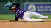 Colorado Rockies shortstop Alan Trejo fields the ball in the eighth inning against the Atlanta Braves at Coors Field. 