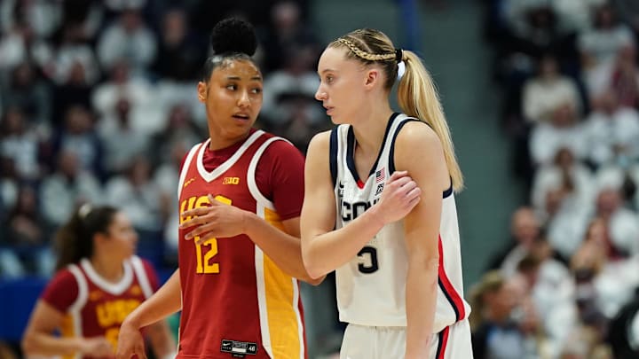 UConn Huskies guard Paige Bueckers (5) and USC Trojans guard JuJu Watkins (12) on the court in the first half at XL Center. UConn Huskies guard Paige Bueckers (5) and USC Trojans guard JuJu Watkins (12) on the court in the first half at XL Center.