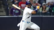Sep 20, 2025; Tampa, Florida, USA; Tampa Bay Rays first baseman Yandy Diaz (2) hits an rbi single against the Boston Red Sox in the seventh inning at George M. Steinbrenner Field. 
