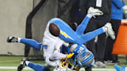 Jul 31, 2025; Canton, Ohio, USA;  Los Angeles Chargers cornerback Eric Rogers (39) breaks up a pass intended for Detroit Lions wide receiver Jakobie Keeney-James (80) during the second half at Tom Benson Hall of Fame Stadium. Mandatory Credit: Charles LeClaire-Imagn Images