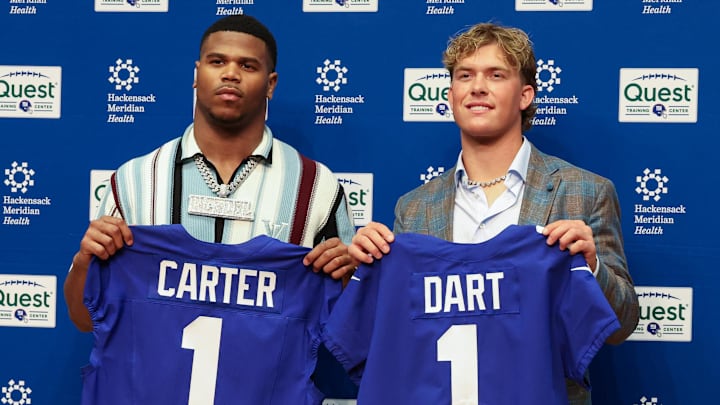 Apr 25, 2025; East Rutherford, NJ, US; New York Giants first-round draft picks, Abdul Carter and Jaxson Dart, pose for photos prior to the start of the press conference.   