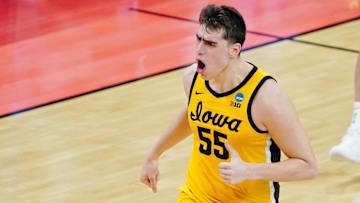 Mar 22, 2021; Indianapolis, Indiana, USA; Iowa Hawkeyes center Luka Garza (55) reacts after a play against the Oregon Ducks during the first half in the second round of the 2021 NCAA Tournament at Bankers Life Fieldhouse. Mandatory Credit: Kirby Lee-Imagn Images