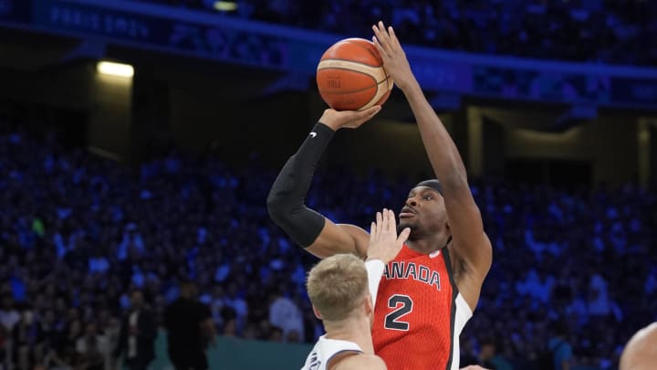 Jul 27, 2024; Villeneuve-d'Ascq, France; Canada guard Shai Gilgeous-Alexander (2) shoots against Greece point guard Thomas Walkup (0) in the first quarter during the Paris 2024 Olympic Summer Games at Stade Pierre-Mauroy. Mandatory Credit: John David Mercer-USA TODAY Sports