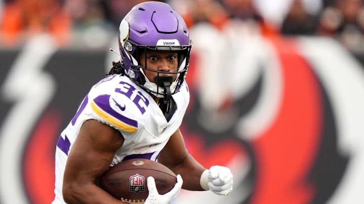 Minnesota Vikings running back Ty Chandler (32) carries the ball in the third quarter of a Week 15 NFL football game between the Minnesota Vikings and the Cincinnati Bengals, Saturday, Dec. 16, 2023, at Paycor Stadium in Cincinnati. The Cincinnati Bengals won 27-24 in overtime.