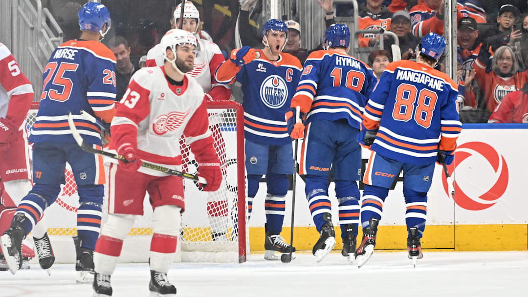 Dec 11, 2025; Edmonton, Alberta, CAN; Edmonton Oilers center Connor McDavid (97) and left winger Zach Hyman (18) celebrate a goal against Detroit Red Wings goalie Cam Talbot (39) during the second period at Rogers Place. Mandatory Credit: Walter Tychnowicz-Imagn Images