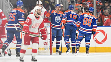 Dec 11, 2025; Edmonton, Alberta, CAN; Edmonton Oilers center Connor McDavid (97) and left winger Zach Hyman (18) celebrate a goal against Detroit Red Wings goalie Cam Talbot (39) during the second period at Rogers Place. Mandatory Credit: Walter Tychnowicz-Imagn Images
