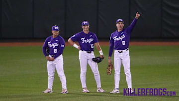 Isaac Cadena (8), Chase Brunson (15), and Noah Franco (6), standing in the outfield awaiting a call during the TCU game against BYU, 04/04/2025