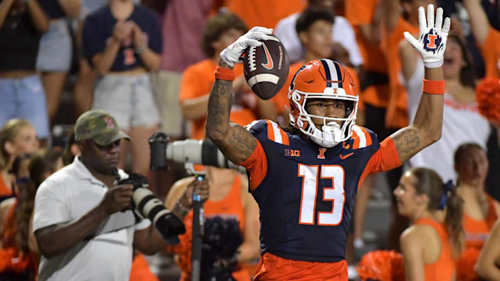 Aug 29, 2024; Champaign, Illinois, USA; Illinois Fighting Illini wide receiver Pat Bryant (13) celebrates his touchdown during the first half against Eastern Illinois Panthers at Memorial Stadium. Aug 29, 2024; Champaign, Illinois, USA; Illinois Fighting Illini wide receiver Pat Bryant (13) celebrates his touchdown during the first half against Eastern Illinois Panthers at Memorial Stadium.