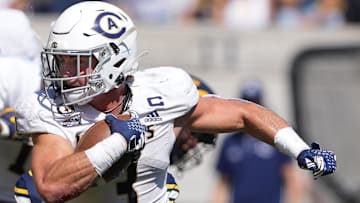 Aug 31, 2024; Berkeley, California, USA; UC Davis Aggies running back Lan Larison (3) carries the ball against the California Golden Bears during the second quarter at California Memorial Stadium. Mandatory Credit: Darren Yamashita-Imagn Images