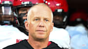 Sep 11, 2025; Winston-Salem, North Carolina, USA;  North Carolina State Wolfpack head coach Dave Doeren walks his team out on the field against the Wake Forest Demon Deacons at Allegacy Federal Credit Union Stadium. Mandatory Credit: Luke Jamroz-Imagn Images