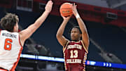 Feb 8, 2025; Syracuse, New York, USA; Boston College Eagles guard Donald Hand Jr. (13) takes a jump shot as Syracuse Orange forward Petar Majstorovic (6) defends in the first half at the JMA Wireless Dome. Mandatory Credit: Mark Konezny-Imagn Images